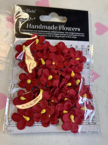 Red mini paper flowers with yellow centres