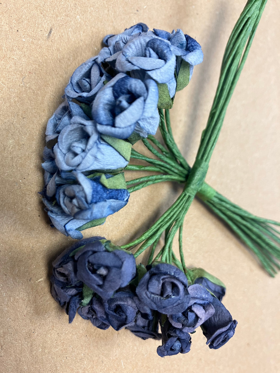 Two bunches of blue paper flowers