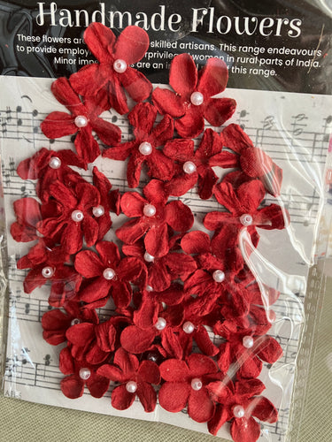 Mini red paper flowers with a pearl centre